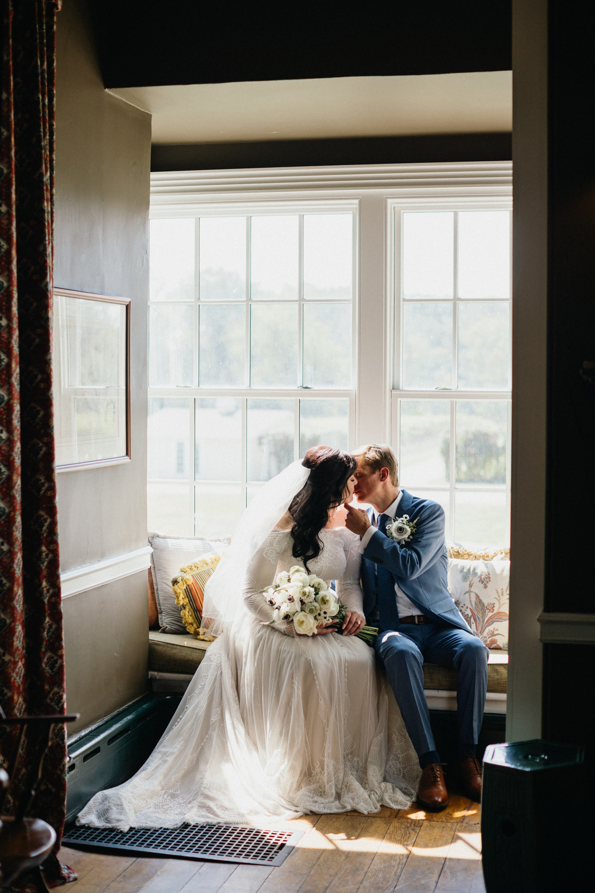 A dreamy, vintage-inspired wedding portrait with warm, golden hues at Grace Winery.