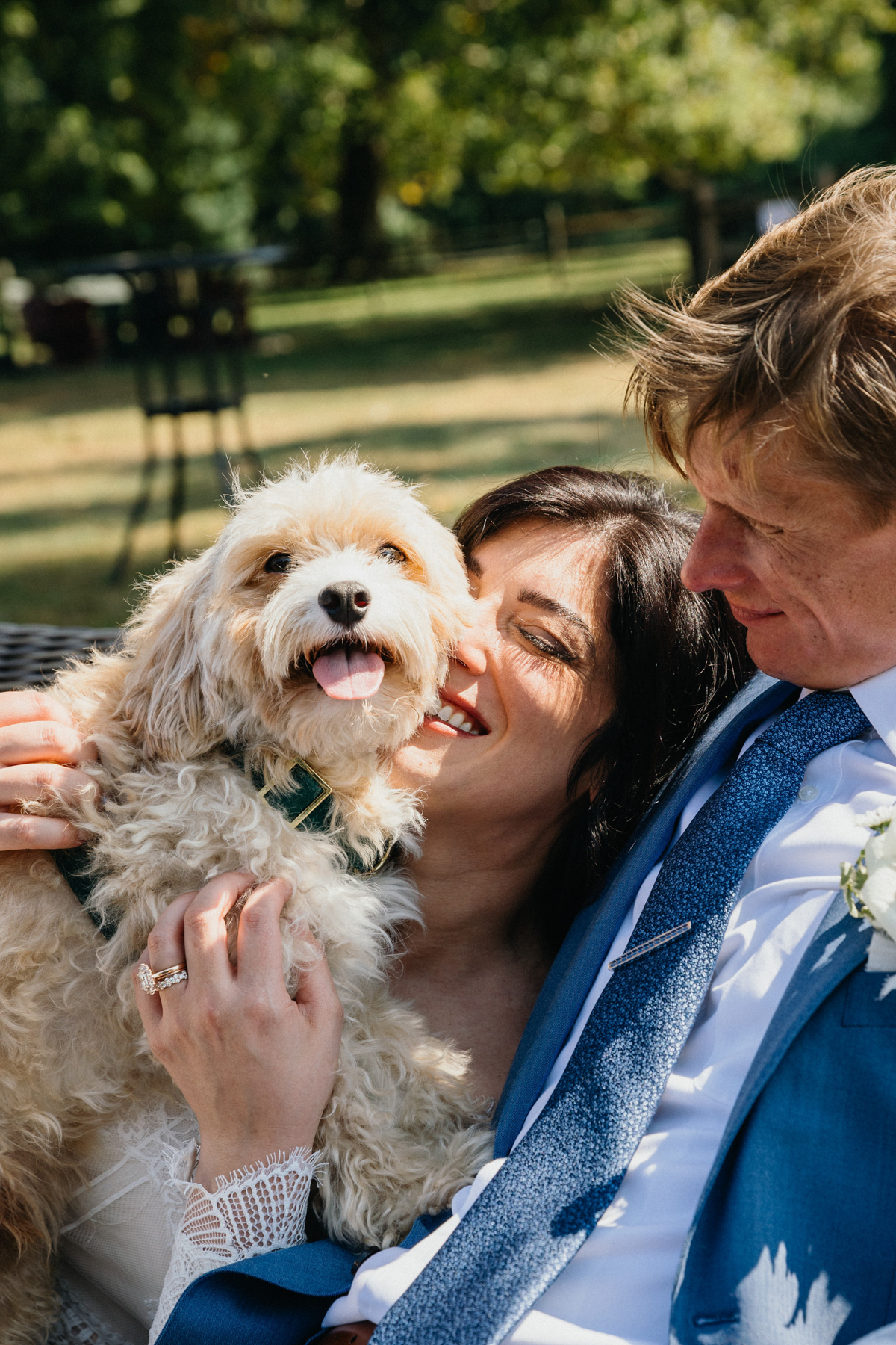 Couple loves on their dog before their Grace Winery wedding ceremony.