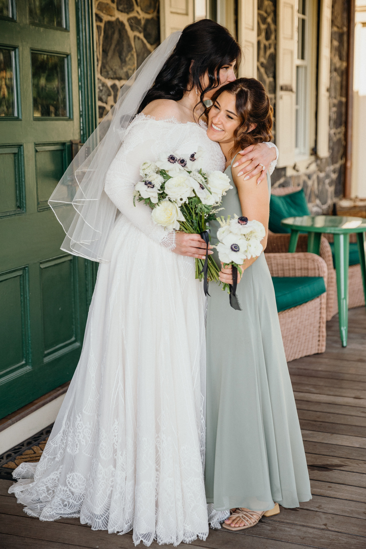 The bride and her best friend sharing a candid moment before the ceremony.