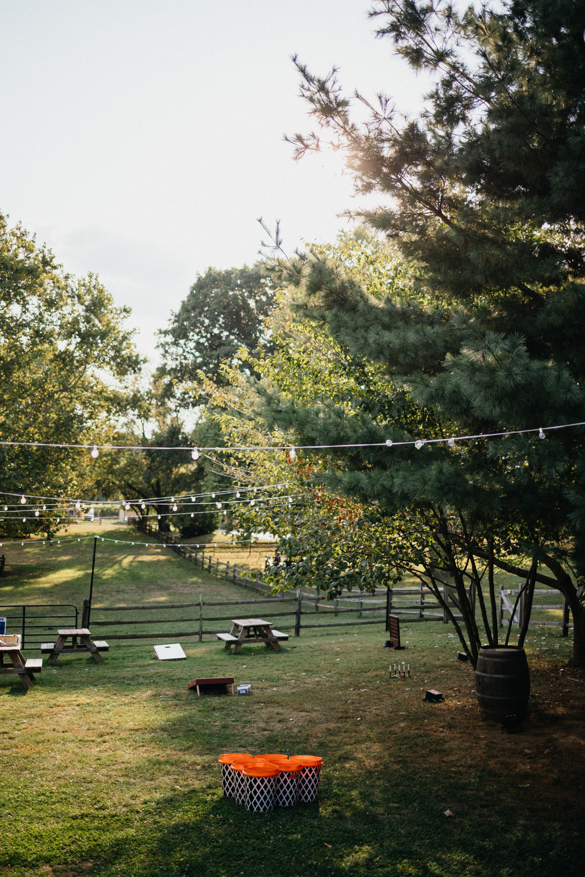 A peaceful vineyard setting with lawn games for a Grace Winery wedding.