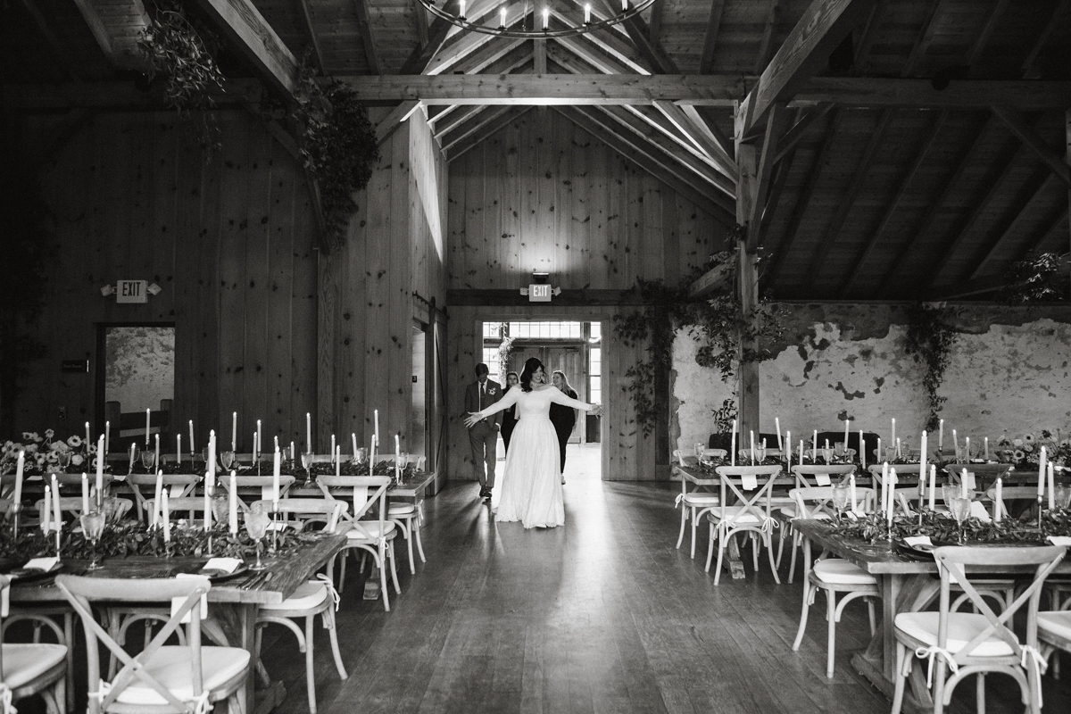 An elegant reception space with vintage decor at a winery wedding.