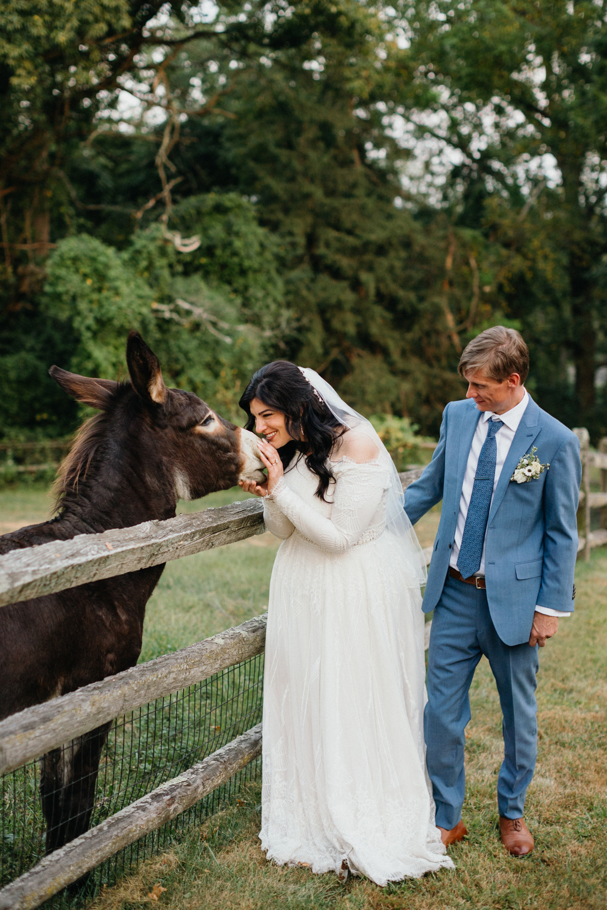 A charming wedding day memory—hand-feeding treats to the horses together at the couple's Grace Winery wedding. 