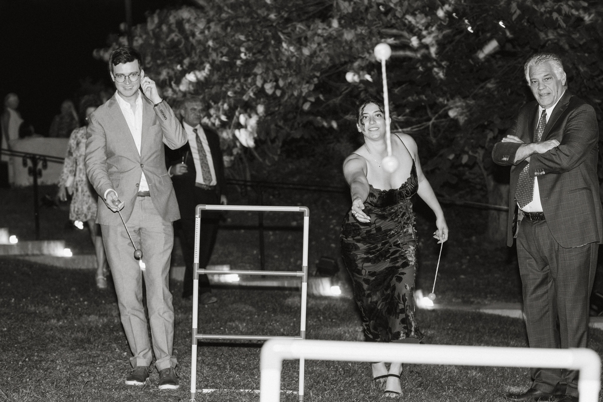 A competitive yet lighthearted moment during wedding lawn games.