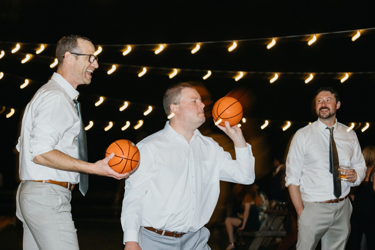 A relaxed wedding reception featuring cornhole and late-night games.