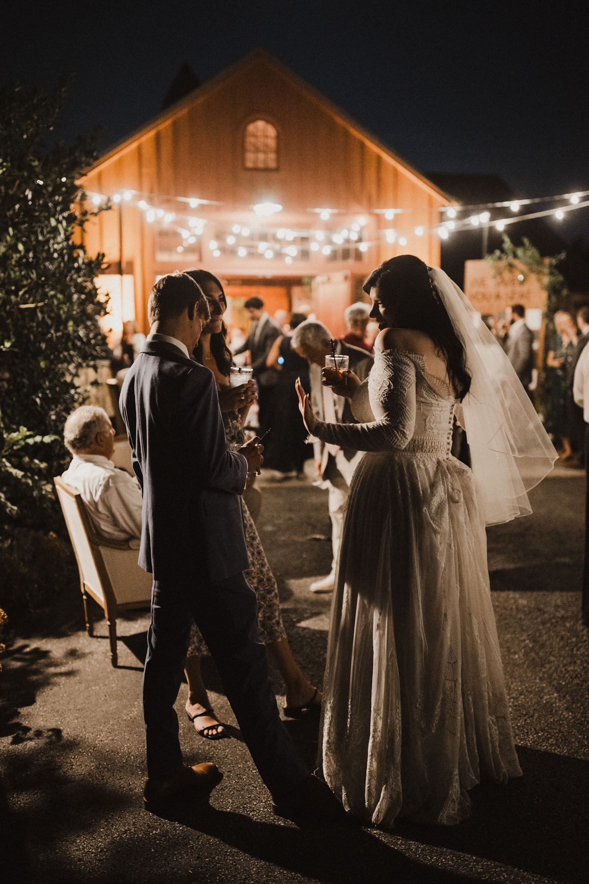 Laughter echoes across the vineyard as guests play lawn games.