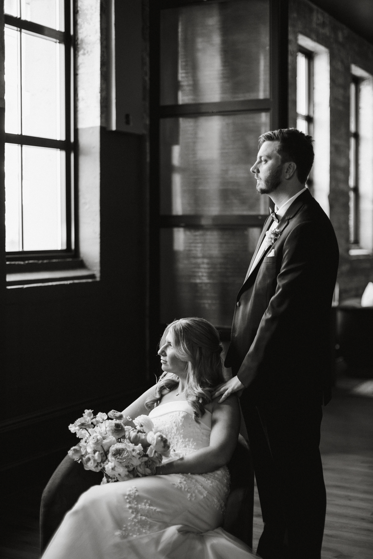 black and white portrait of wedding couple in lobby of switch house hotel