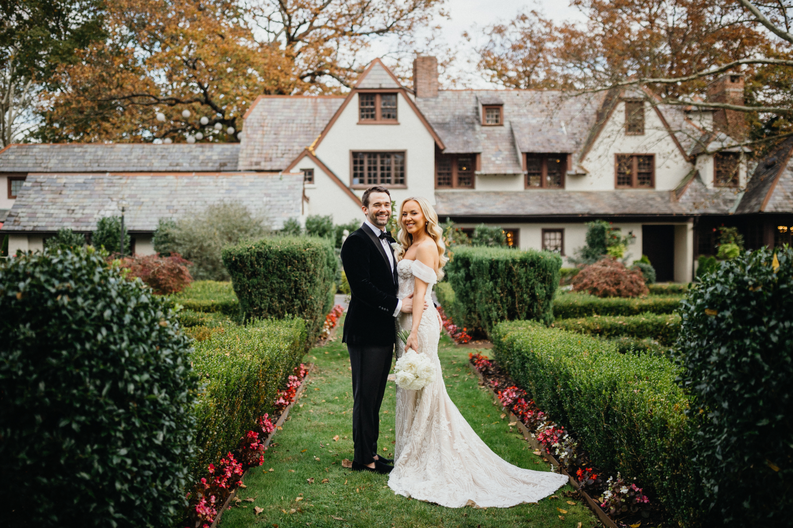 A dreamy portrait of the newlyweds in the garden at Hotel Du Village wedding, framed by soft greenery.