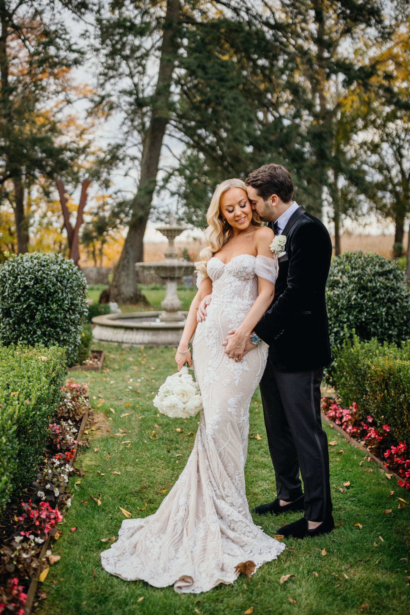 A quiet embrace near the ivy-covered walls.