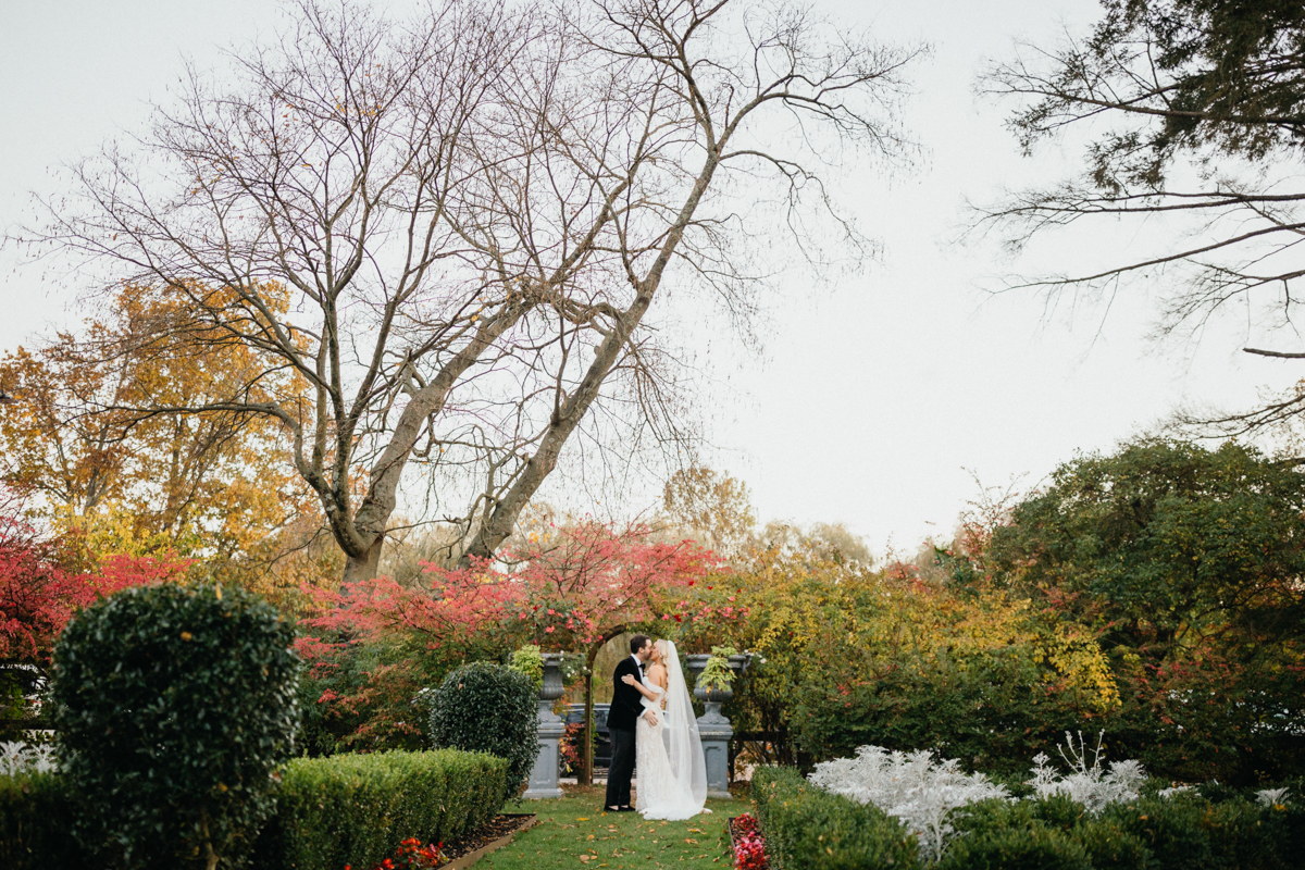 Estate wedding venue near Philadelphia with a timeless brick façade and enchanting rose garden.