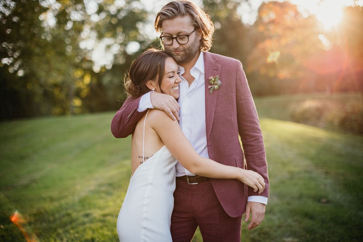 A candid moment from the relaxed wedding, as the couple shares a quiet conversation before the ceremony.