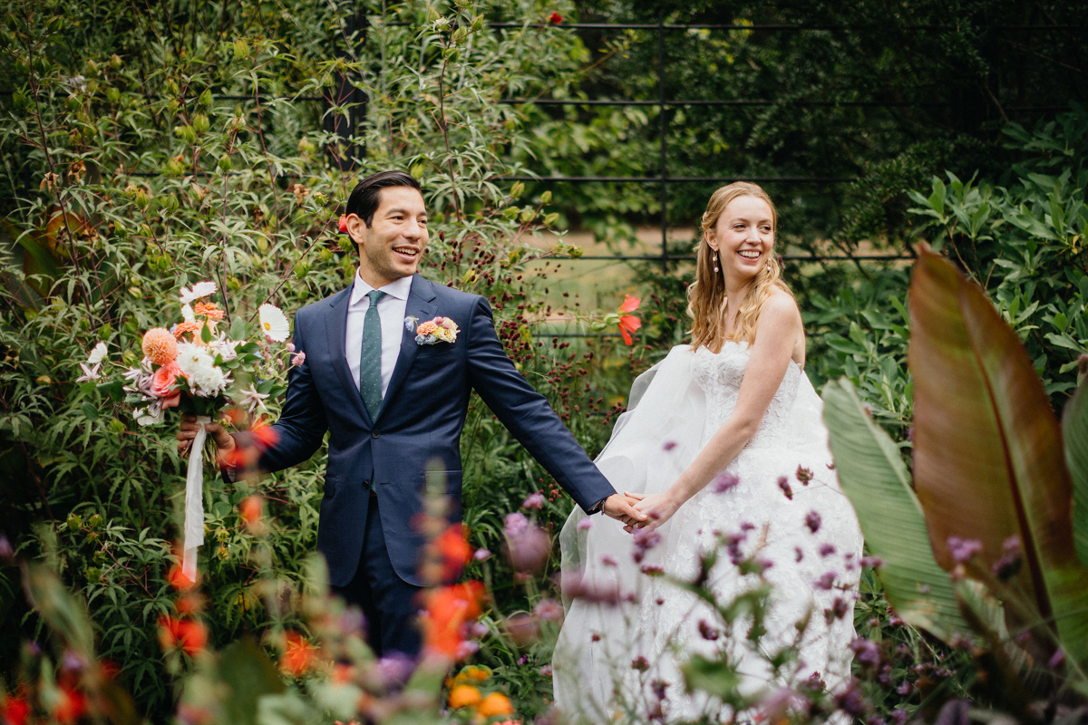 A fun, carefree moment at a Morris Arboretum and Gardens wedding.