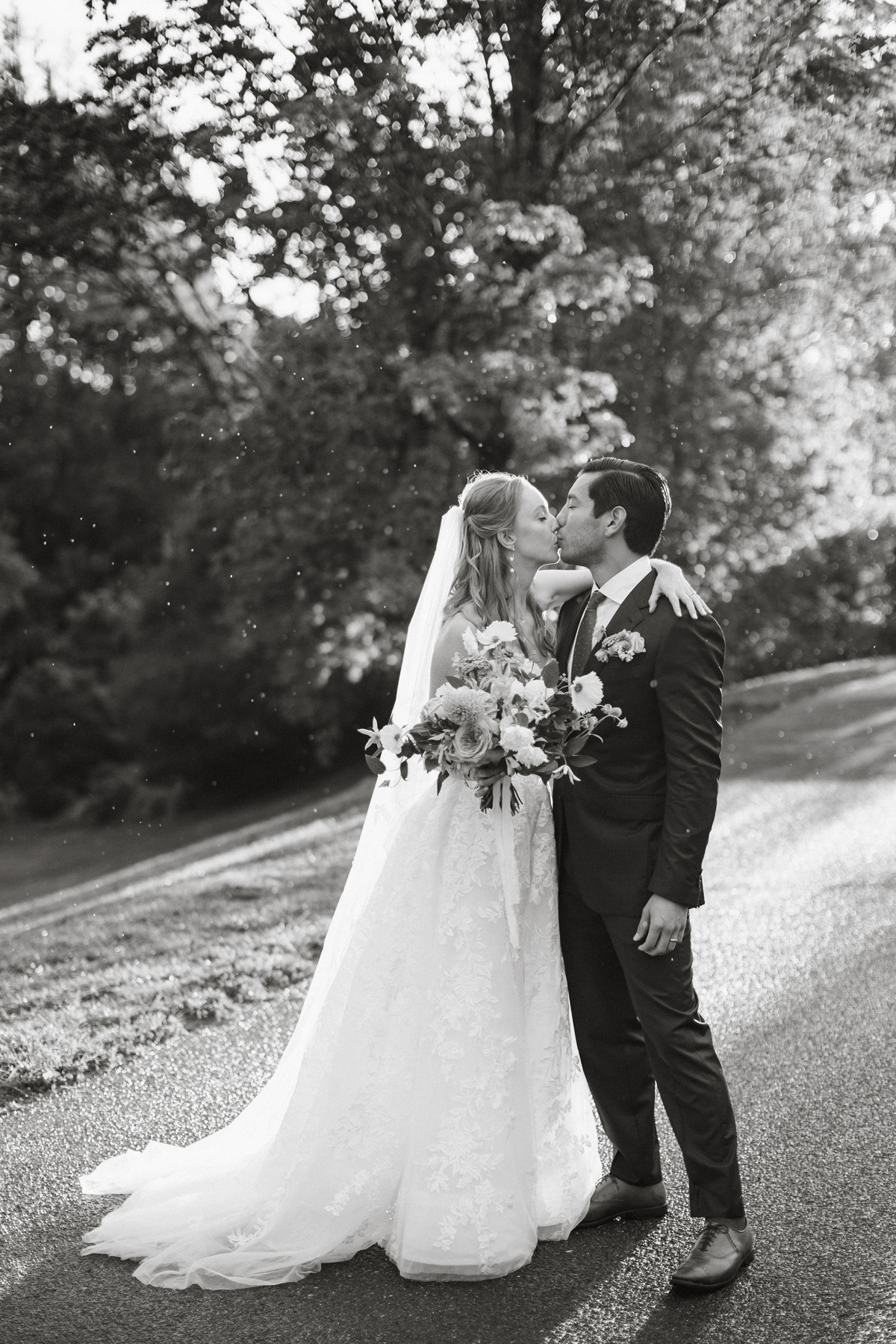 Soft golden light highlights a candid moment captured by a Philadelphia wedding photographer.