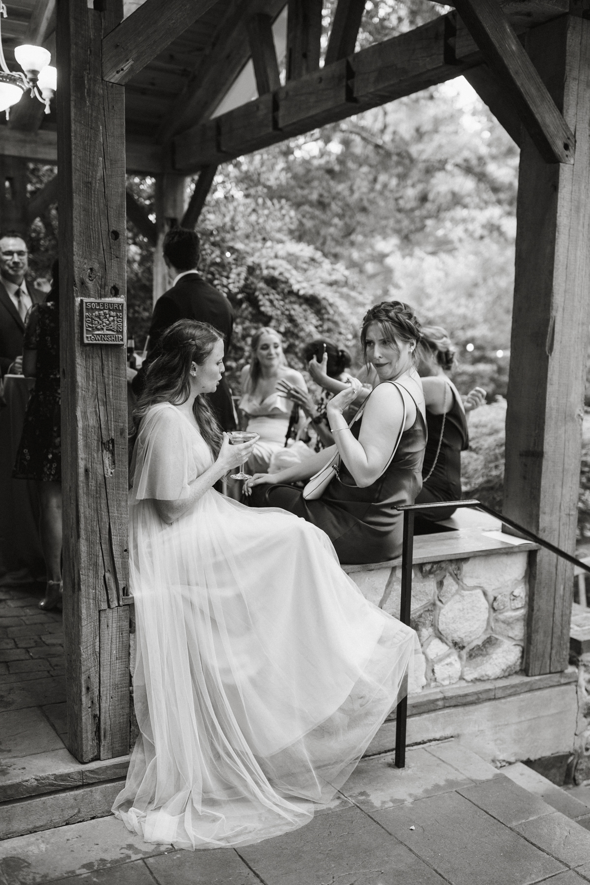 black and white candid from cocktail hour captured by philadelphia wedding photographer
