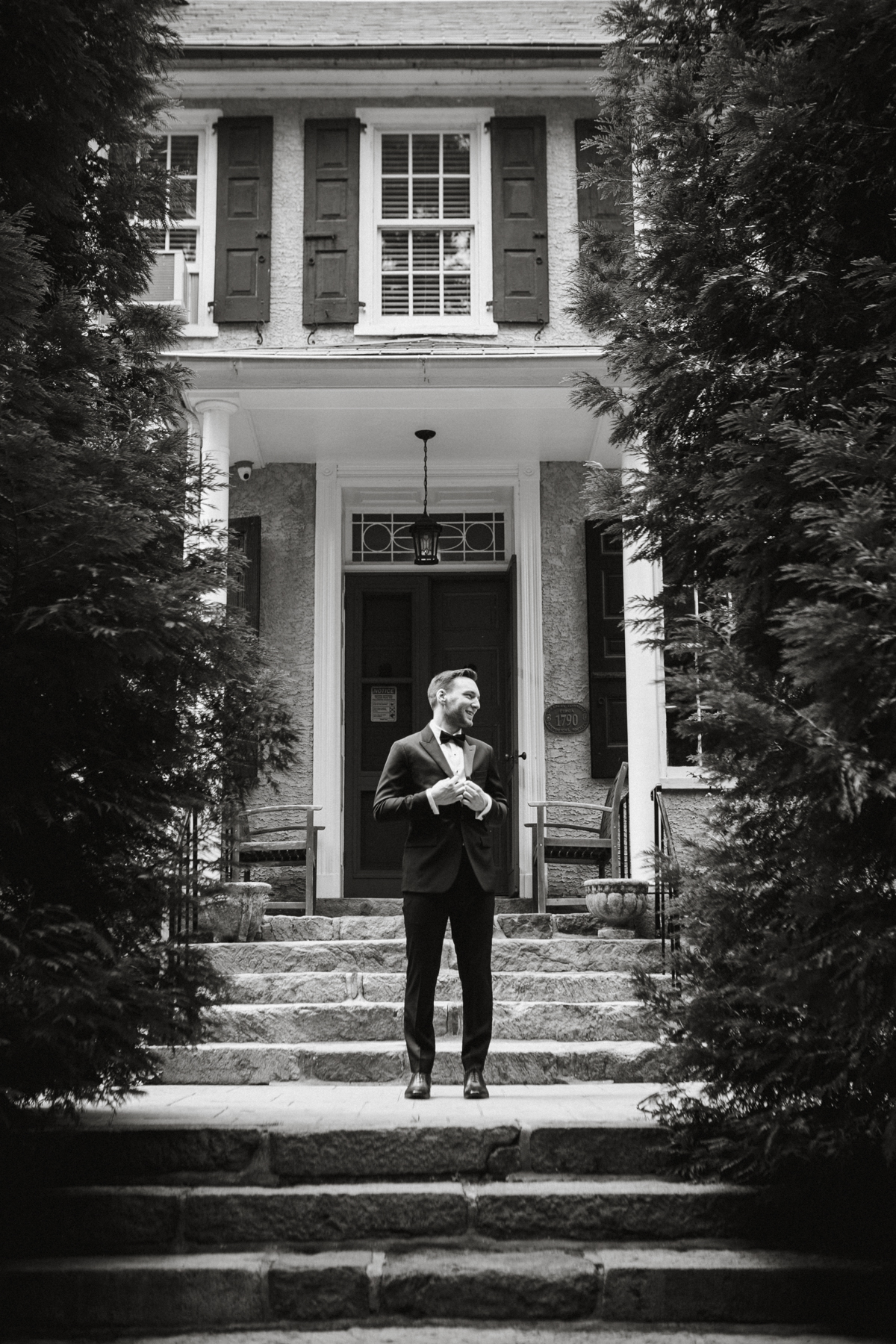 groom in front of new hope pennsylvania wedding venue