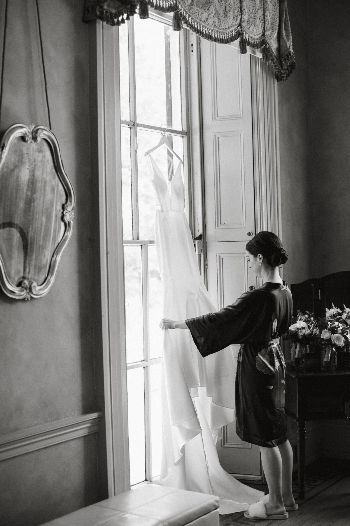 Bride admiring dress in mirror – Glen Foerd wedding