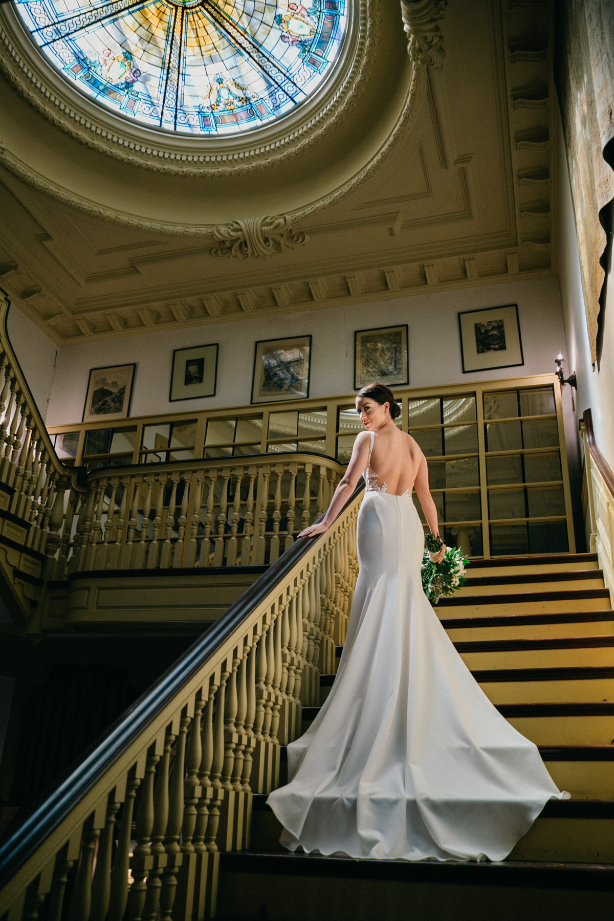 Quiet bridal moment near staircase – Glen Foerd on the Delaware wedding