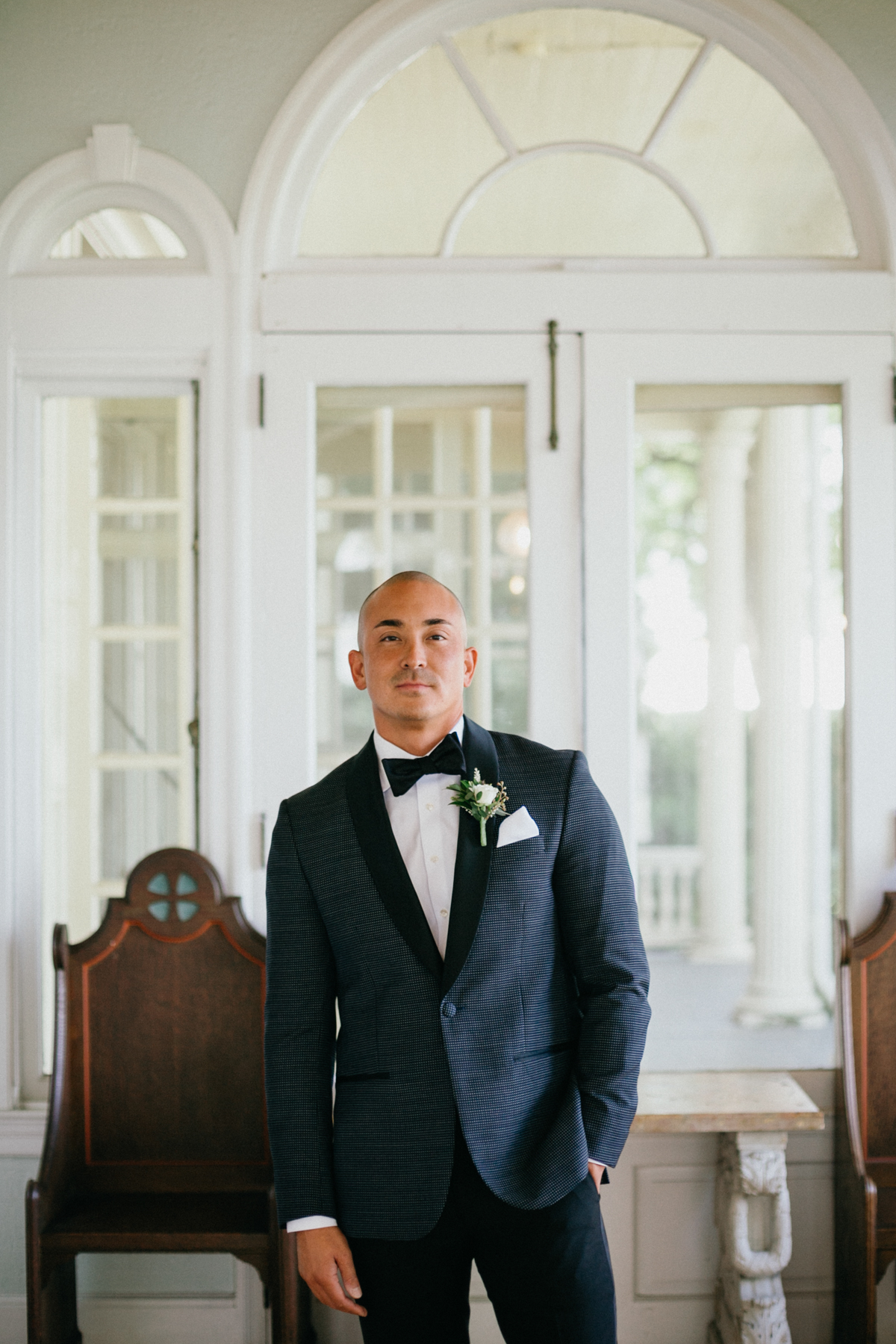 Groom portrait near river – Glen Foerd on the Delaware