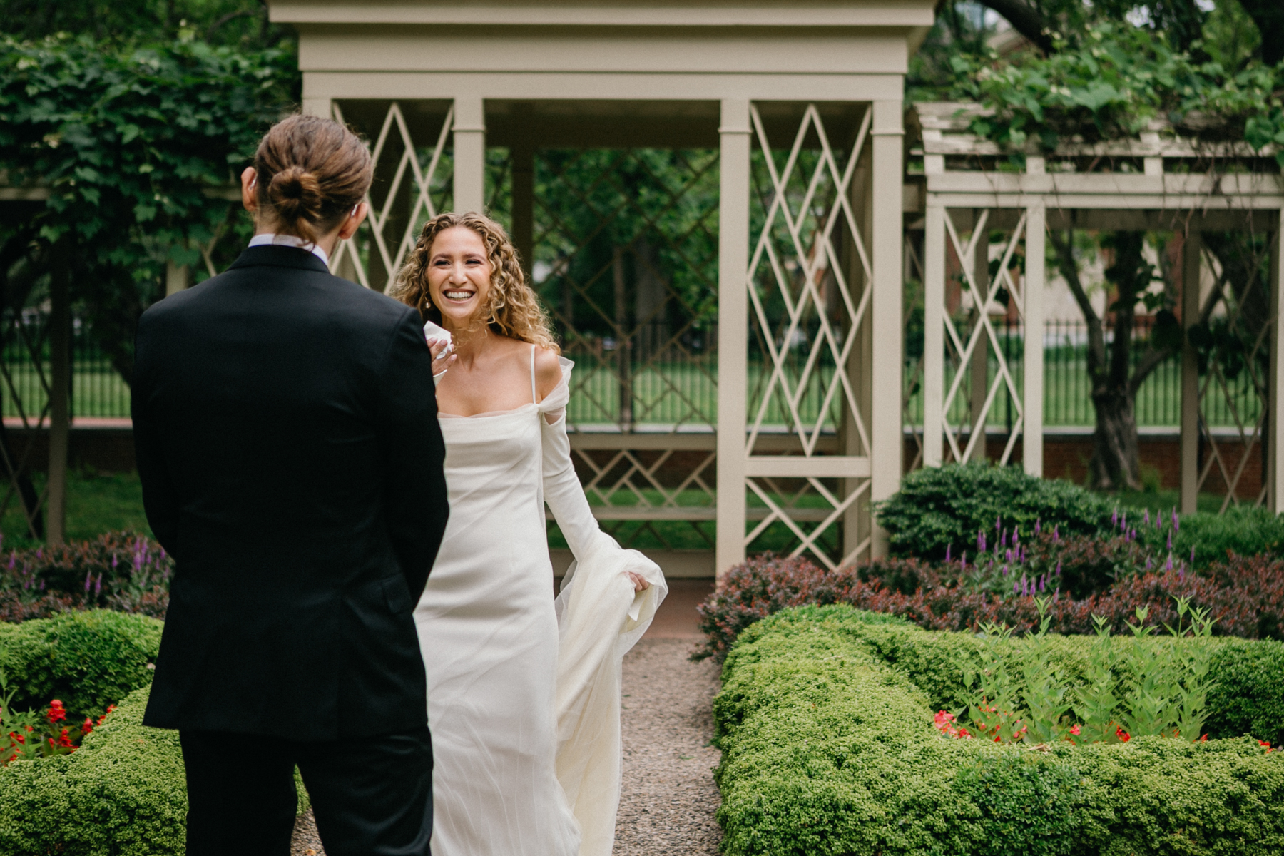 First look in the 18th Century Garden surrounded by spring blooms. – Zahav wedding in Philadelphia, Philadelphia wedding photographer.