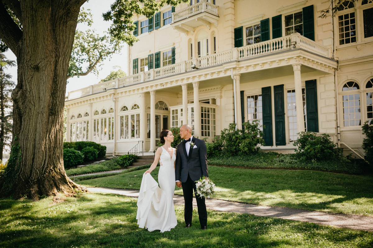 Natural garden portrait with bride and groom laughing – candid wedding photography