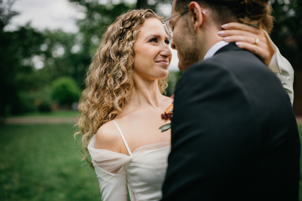 Close-up of the couple framed by soft greenery – Philadelphia wedding