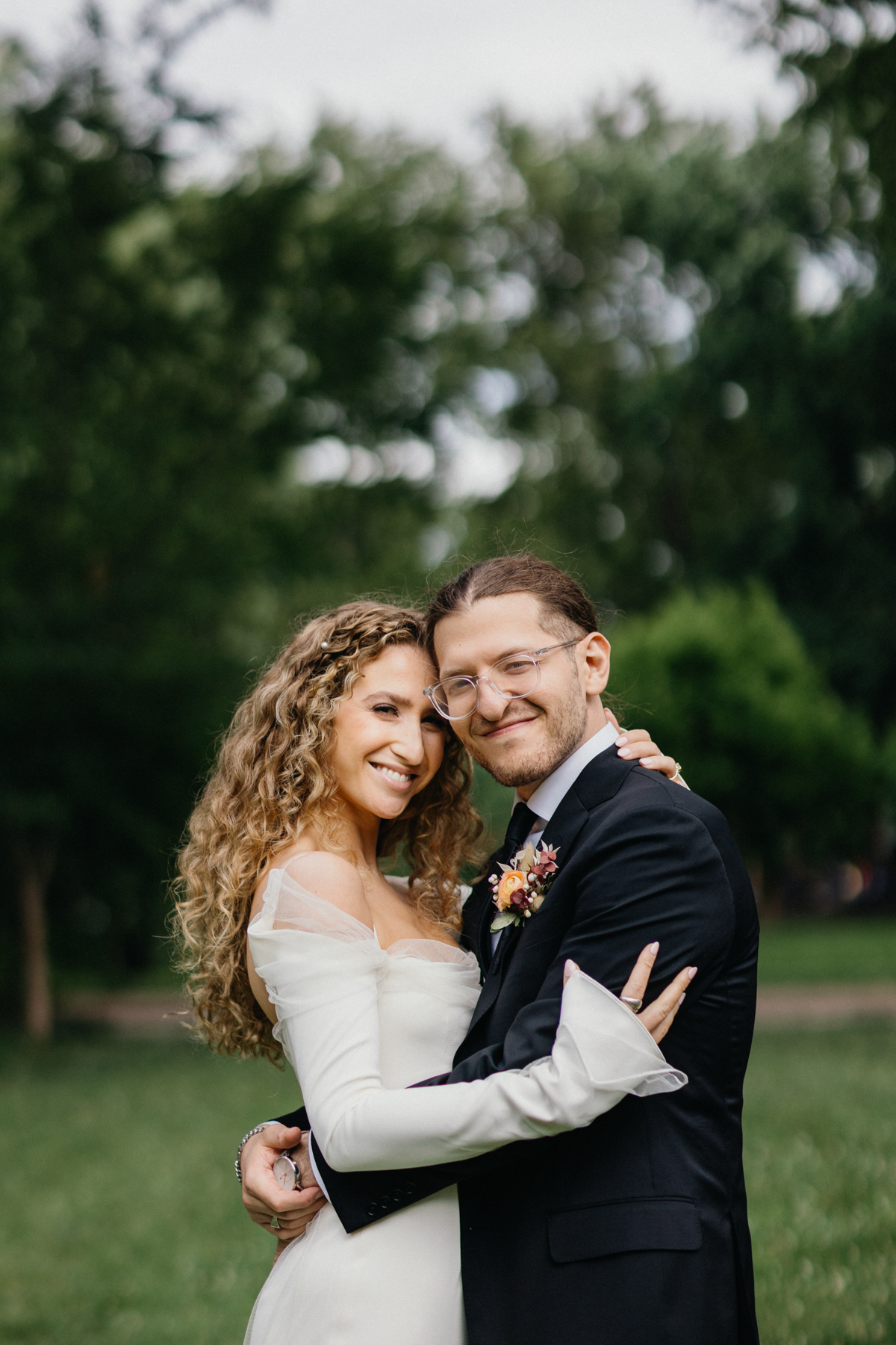 Foreheads touching during a quiet pause in the garden. – Editorial photographer, Philadelphia wedding.
