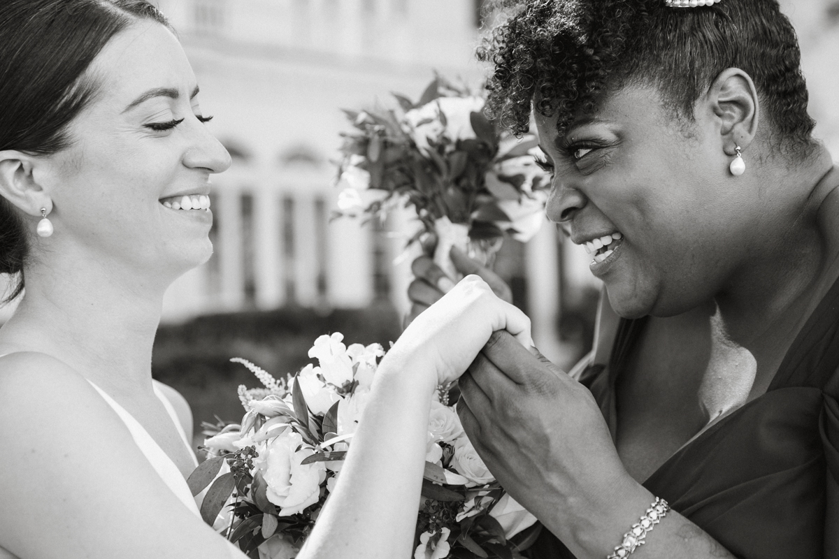 Bride and maid of honor s on mansion lawn – Philadelphia wedding venue