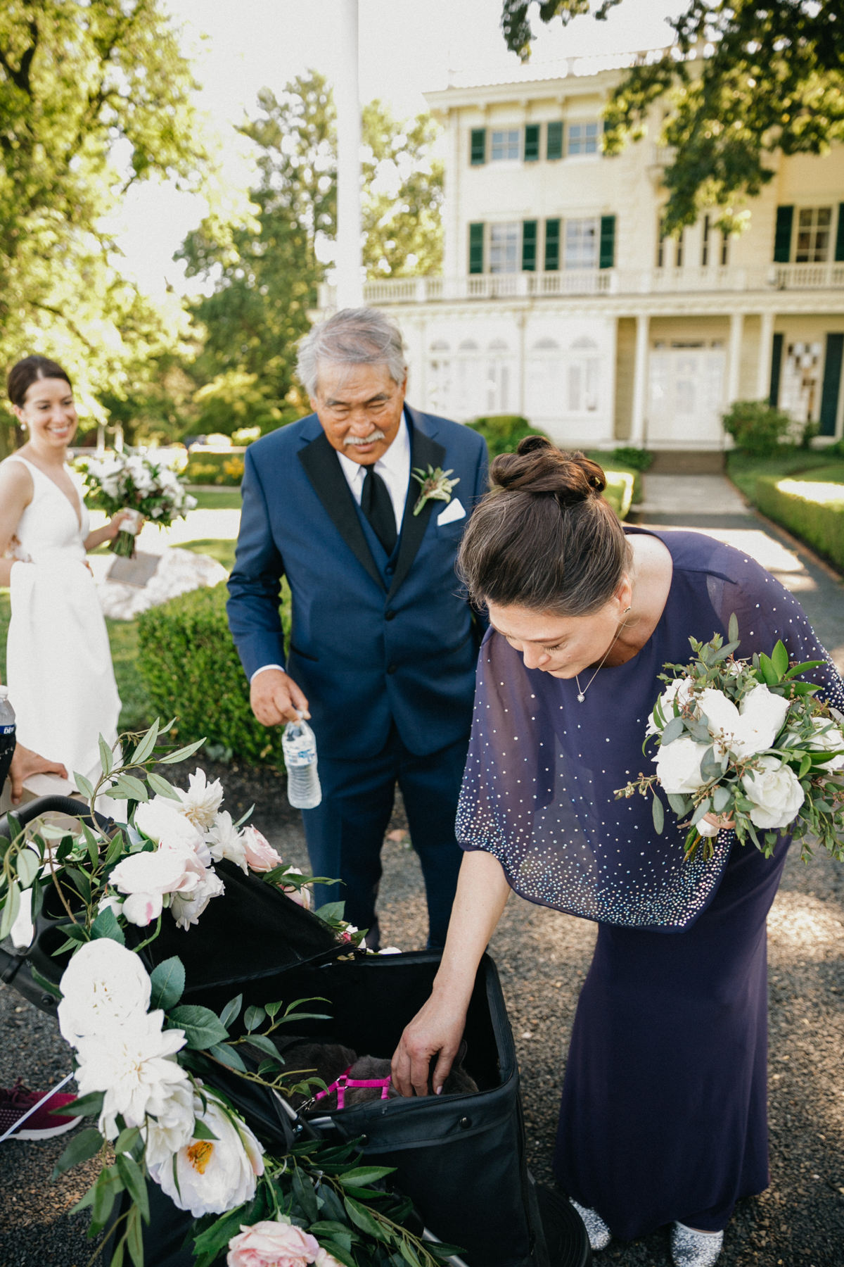 Guests petting the cat ring bearer before Glen Foerd ceremony