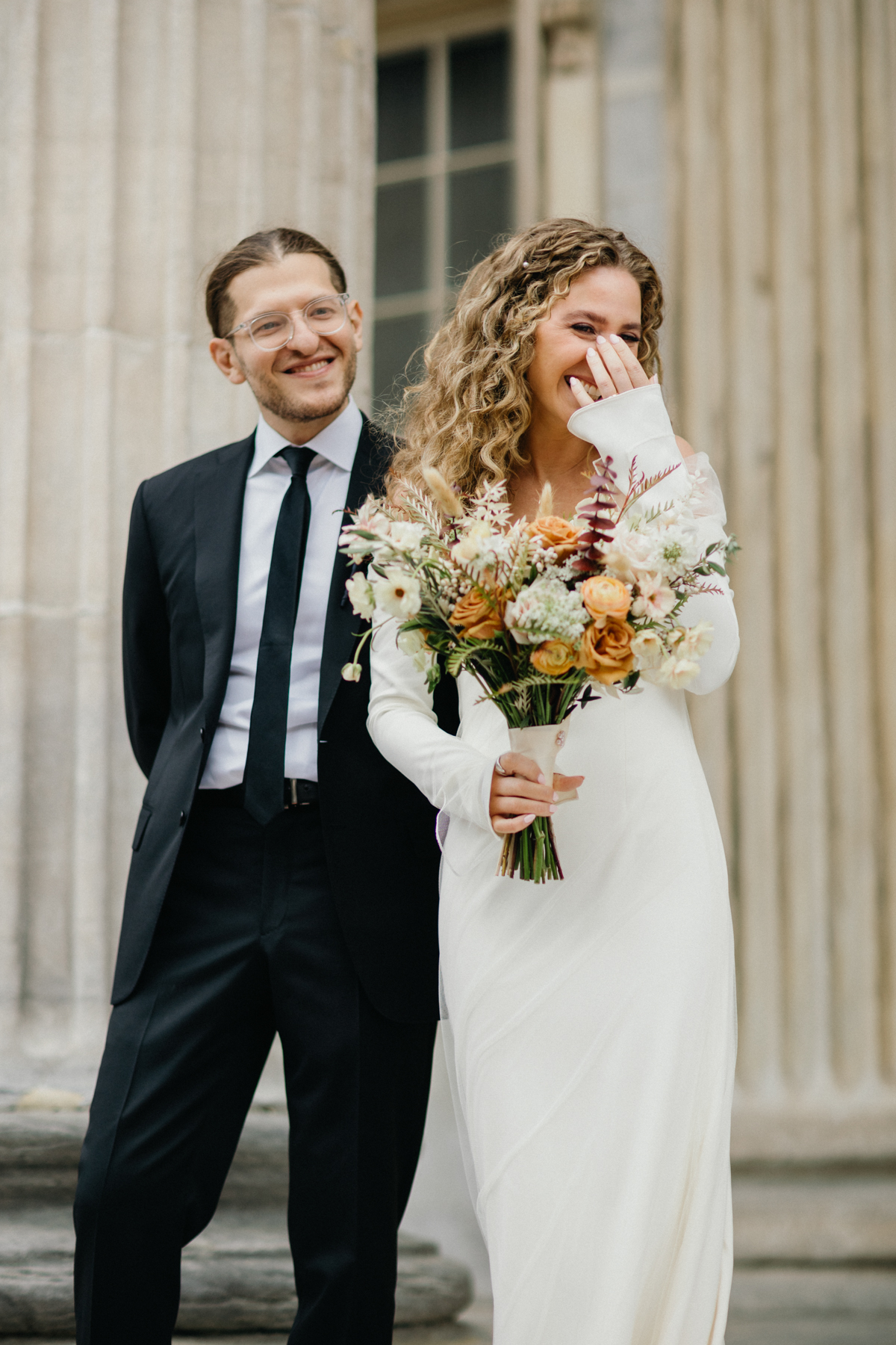 Portrait with Merchants Exchange columns in the background – Philly wedding, editorial photographer