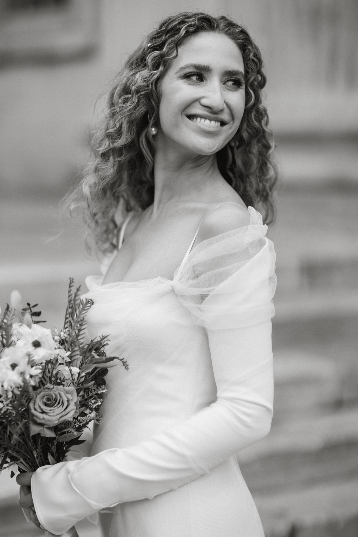 Bride looking over her shoulder during portraits – Philly wedding, editorial photographer
