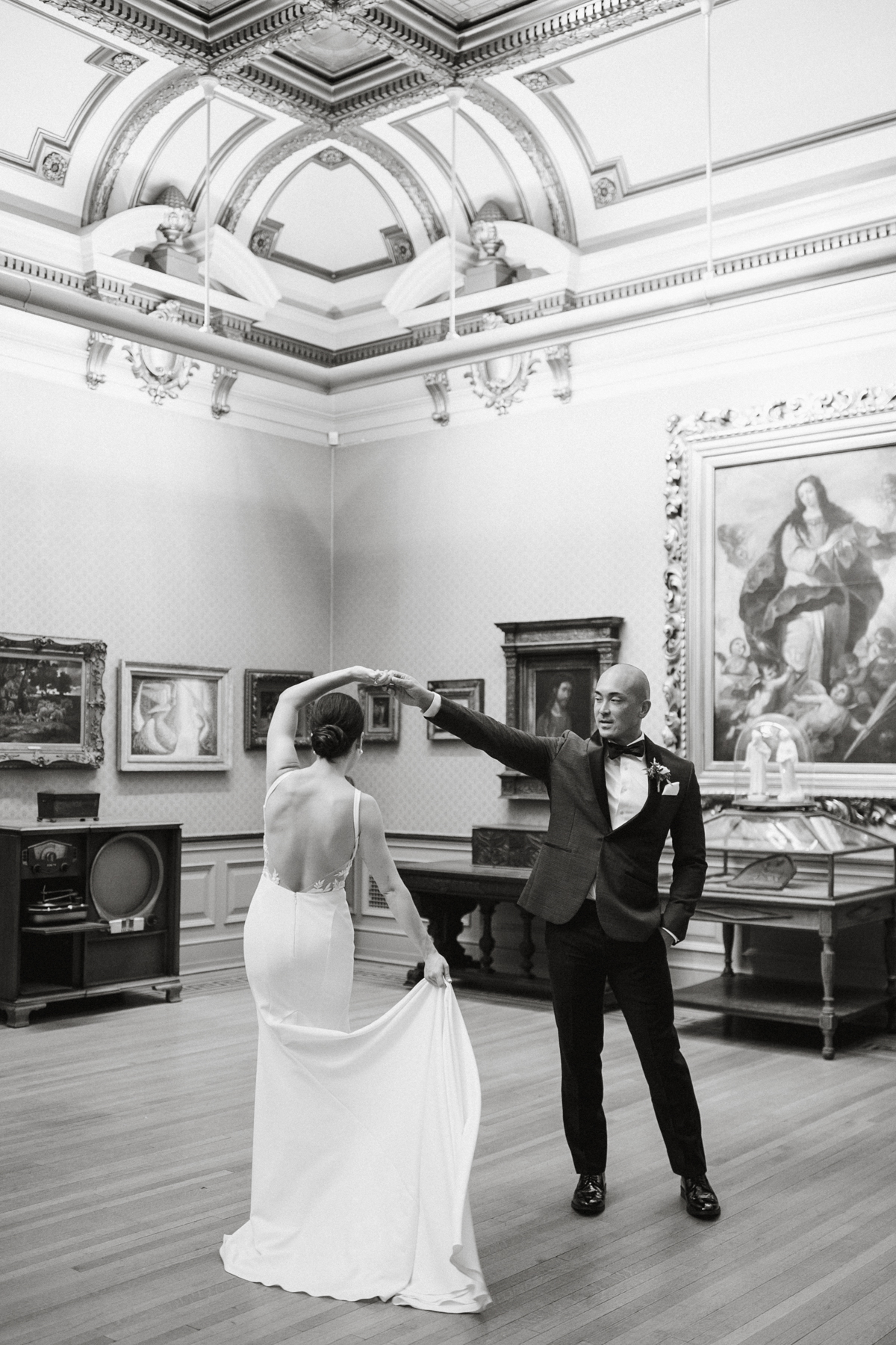 Candid moment in art gallery at Glen Foerd wedding – candid wedding photography