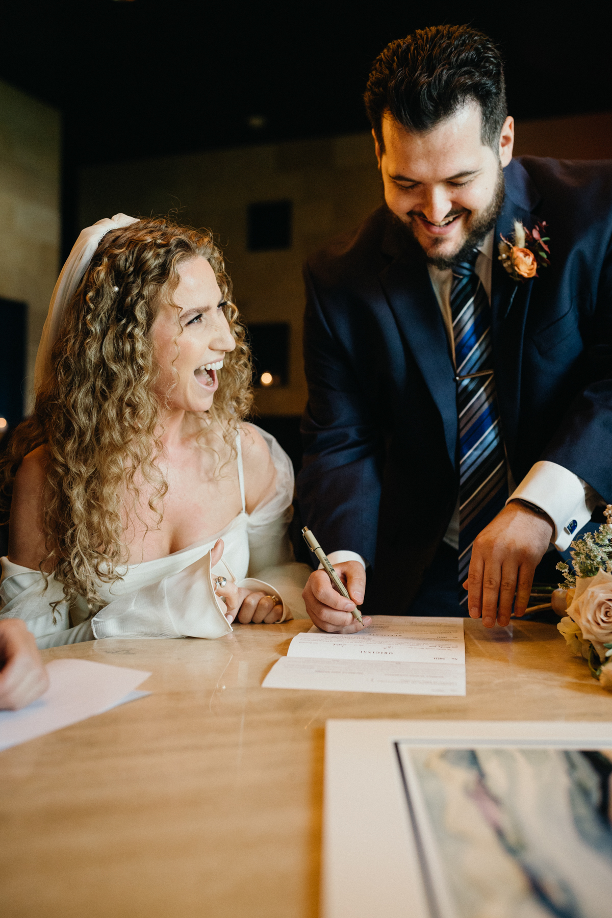smiling and chatting during the ketubah ceremony – Restaurant wedding venue in Philadelphia, candid photography