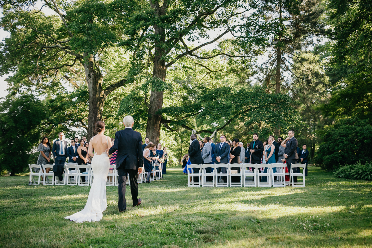 Ceremony view from behind guests – candid wedding photography