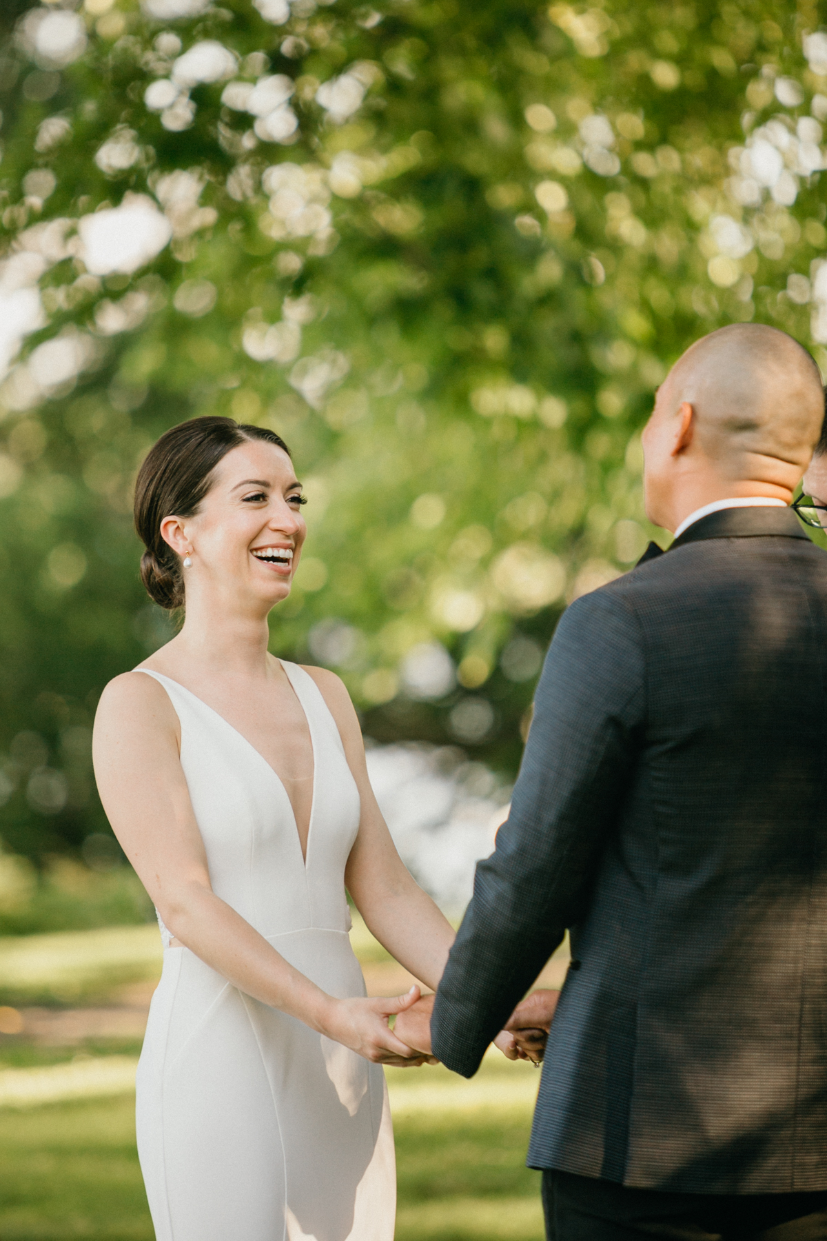 Bride and groom exchanging heartfelt vows under the trees – Glen Foerd wedding ceremony