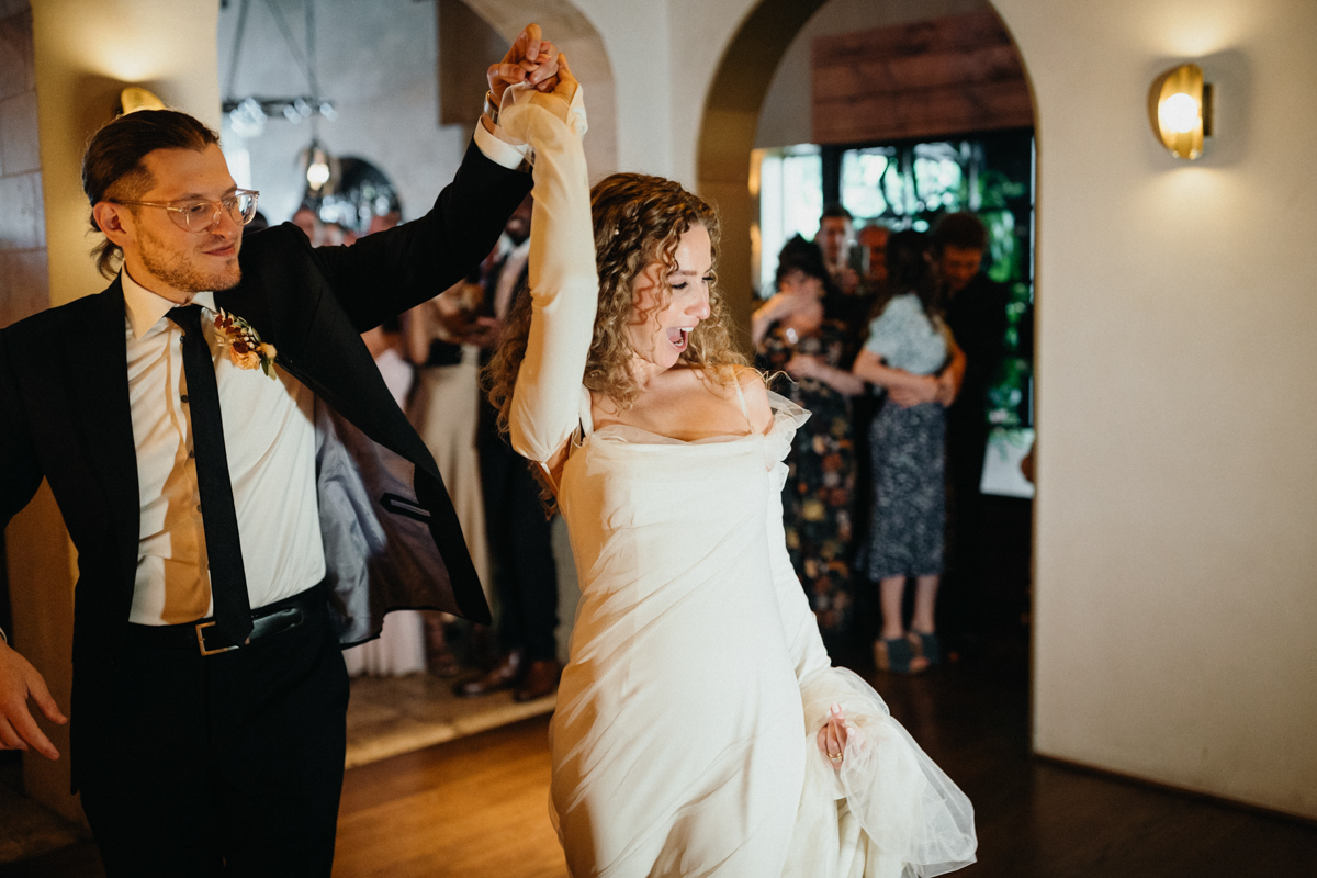 Couple’s first dance surrounded by candlelight at Zahav – Zahav wedding in Philadelphia, editorial photographer