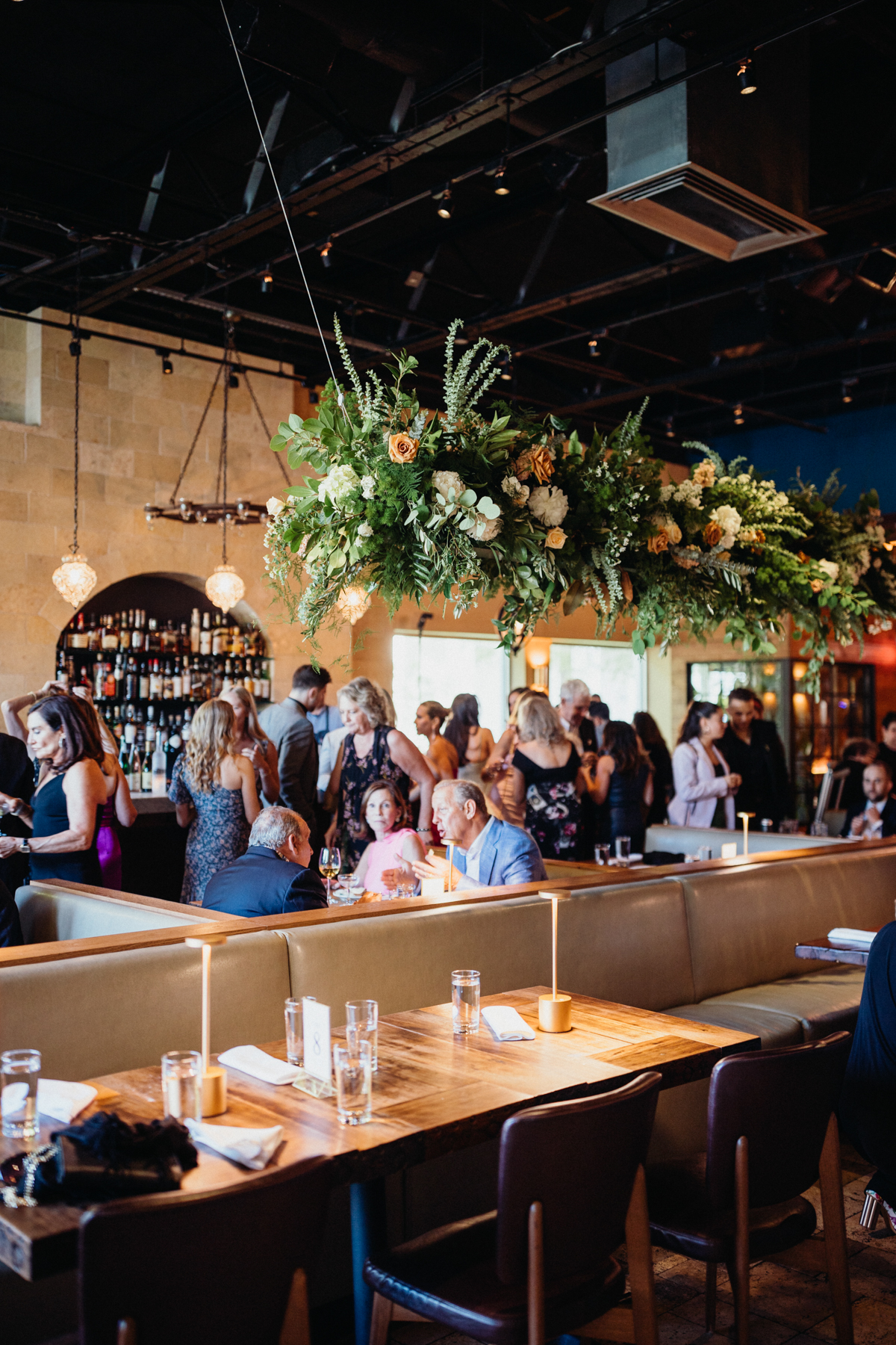 Laughter echoing through Zahav’s wedding reception interior – Philly wedding, documentary photography