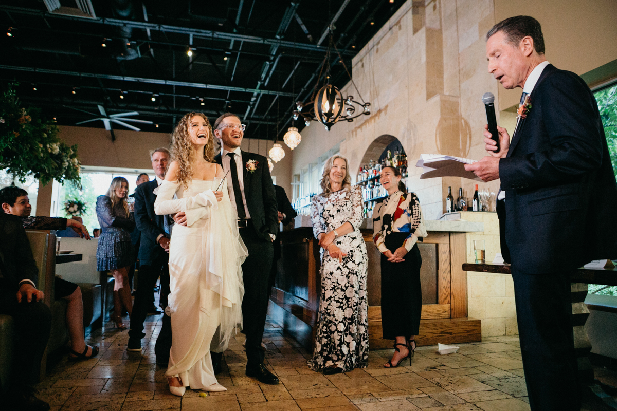 Couple laughing during a toast at Zahav – Restaurant wedding venue in Philadelphia, Philly wedding
