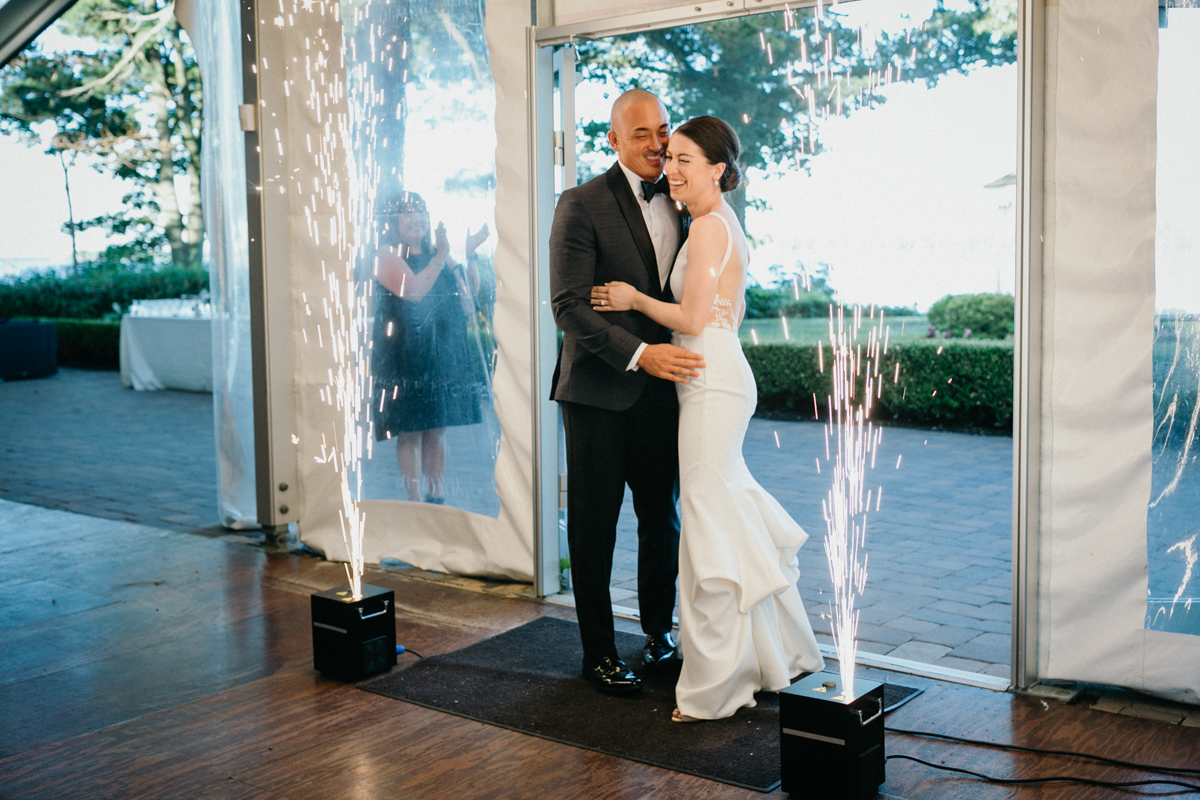 Sparkler entrance in front of river – traditional wedding photographer