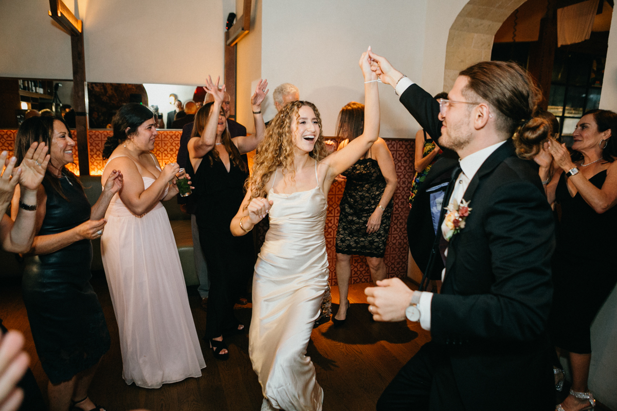 Joyful moment of the bride mid-spin during the reception – Editorial photographer, Philly wedding