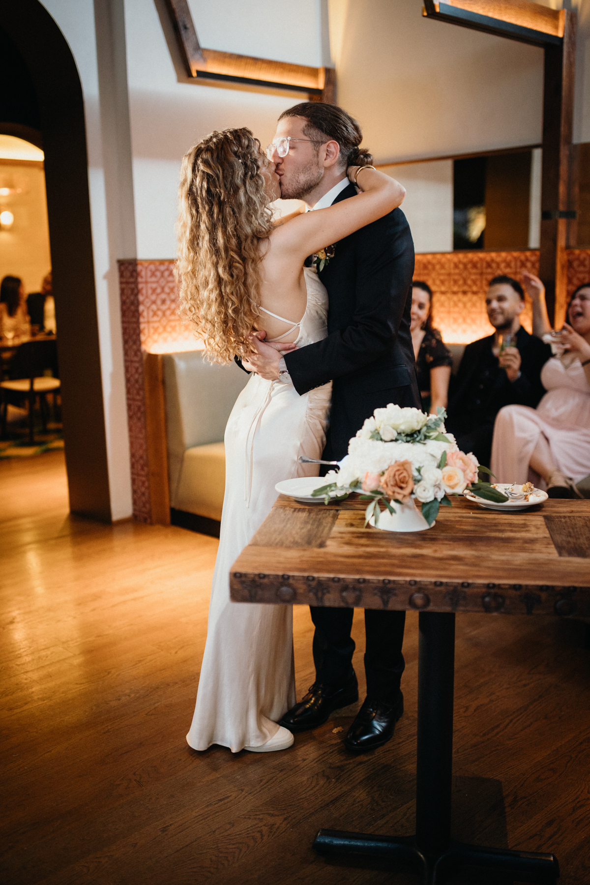 Cake cutting moment with big laughs from the couple – Zahav wedding, documentary photography