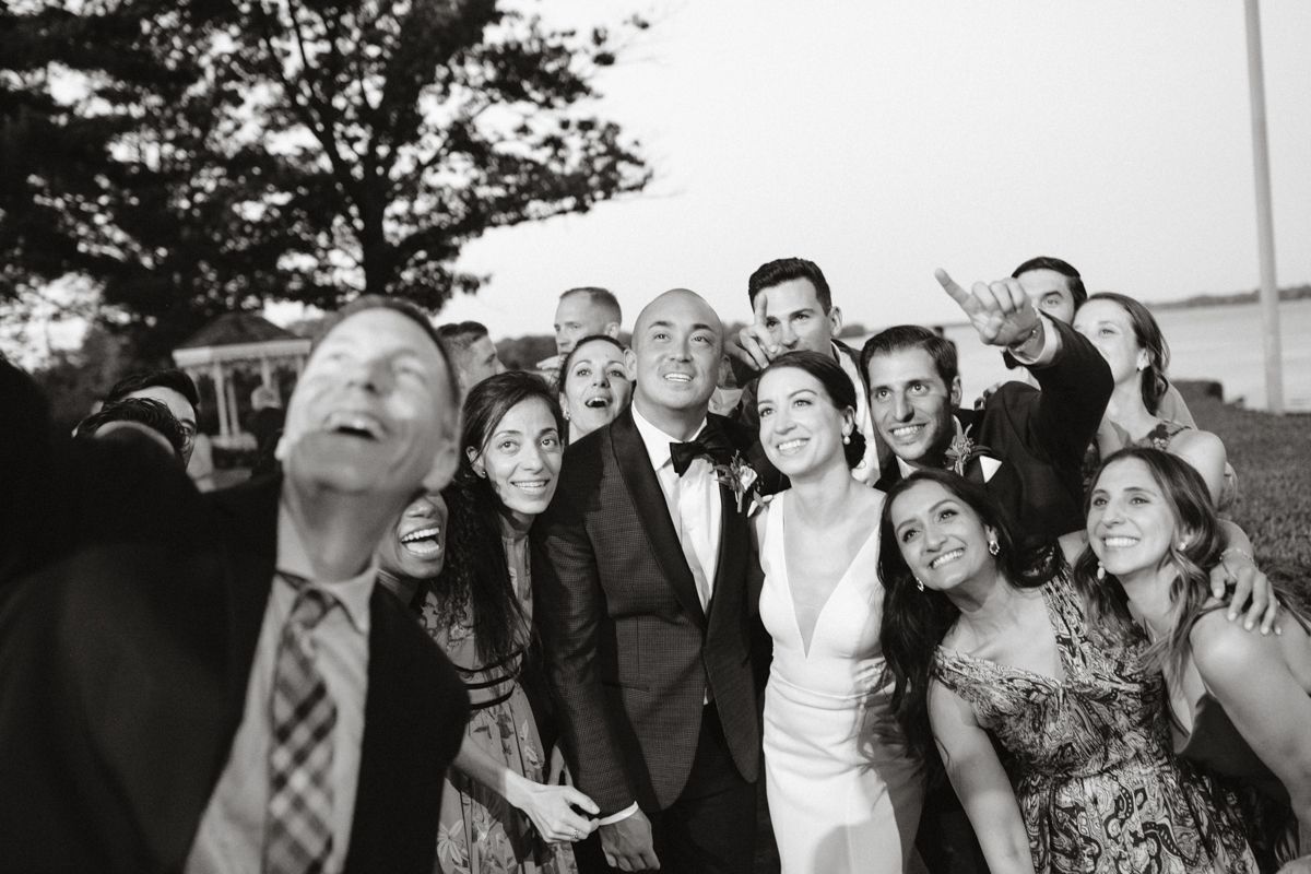 Friends taking selfies at reception – documentary wedding photography