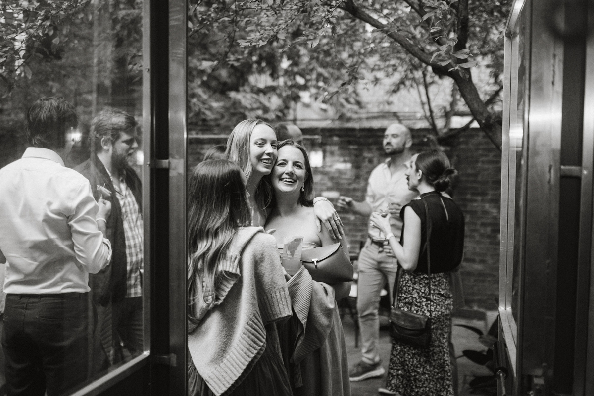 Candid guest portraits by a Philly wedding photographer at Vita’s speakeasy