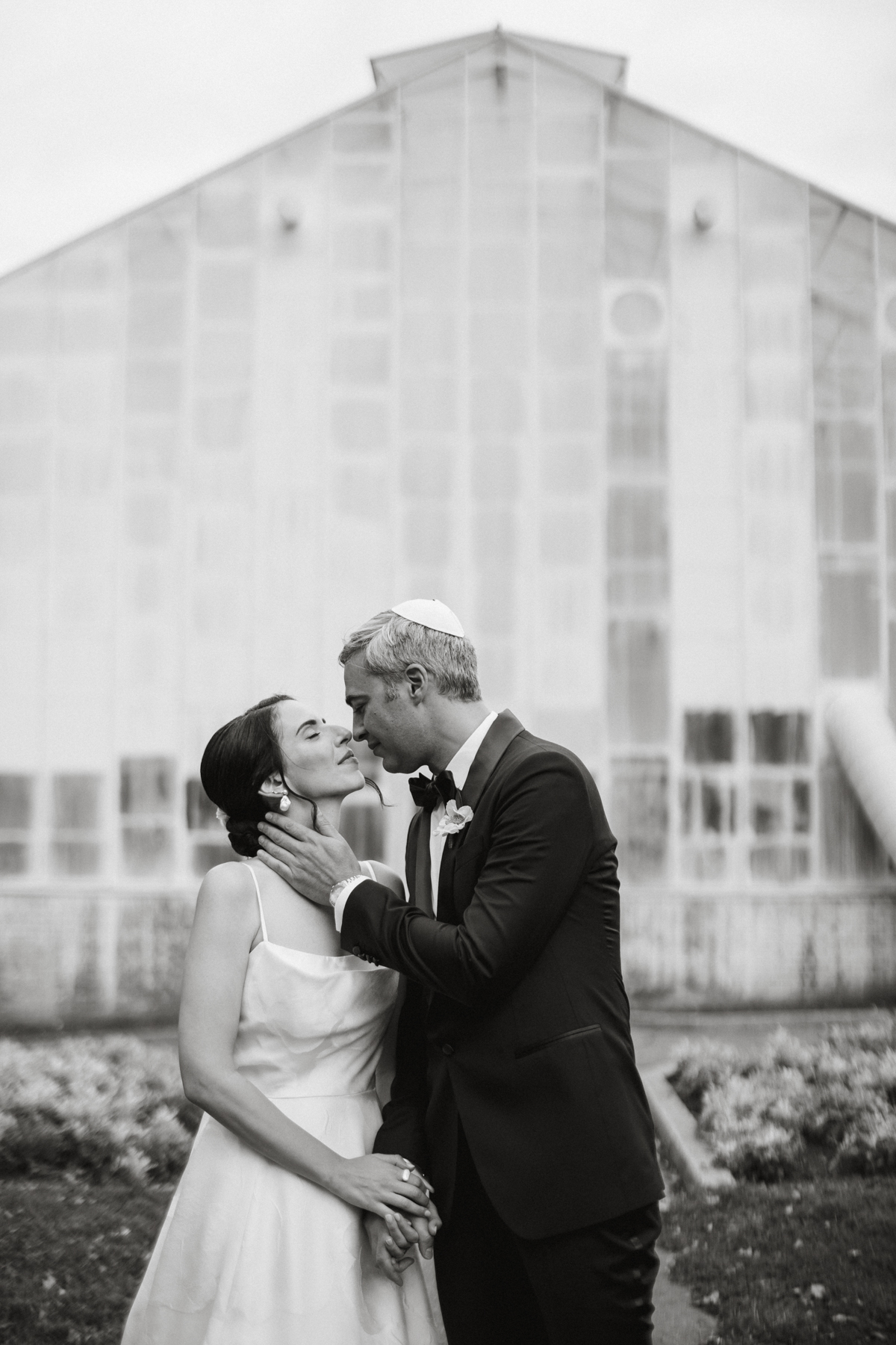 Editorial-style couple shot outside the Fairmount Park Horticulture Center