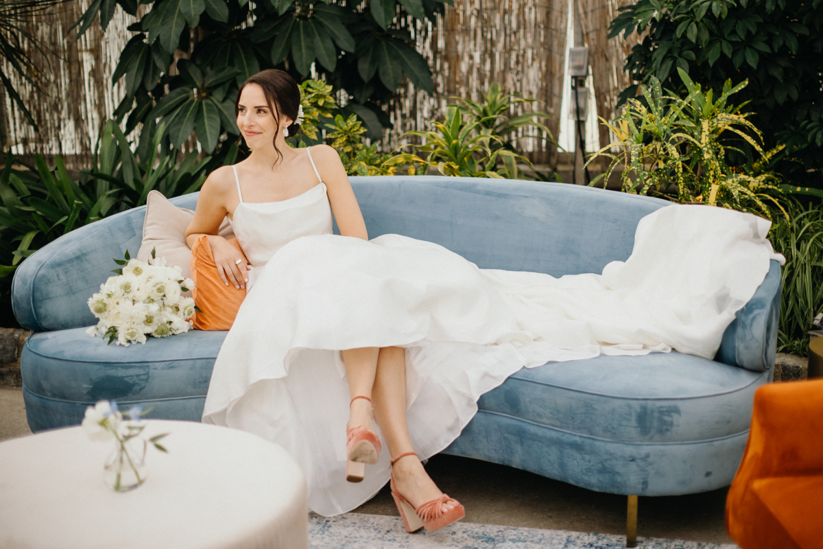 Bride smiling during solo portraits in the Horticulture Center garden