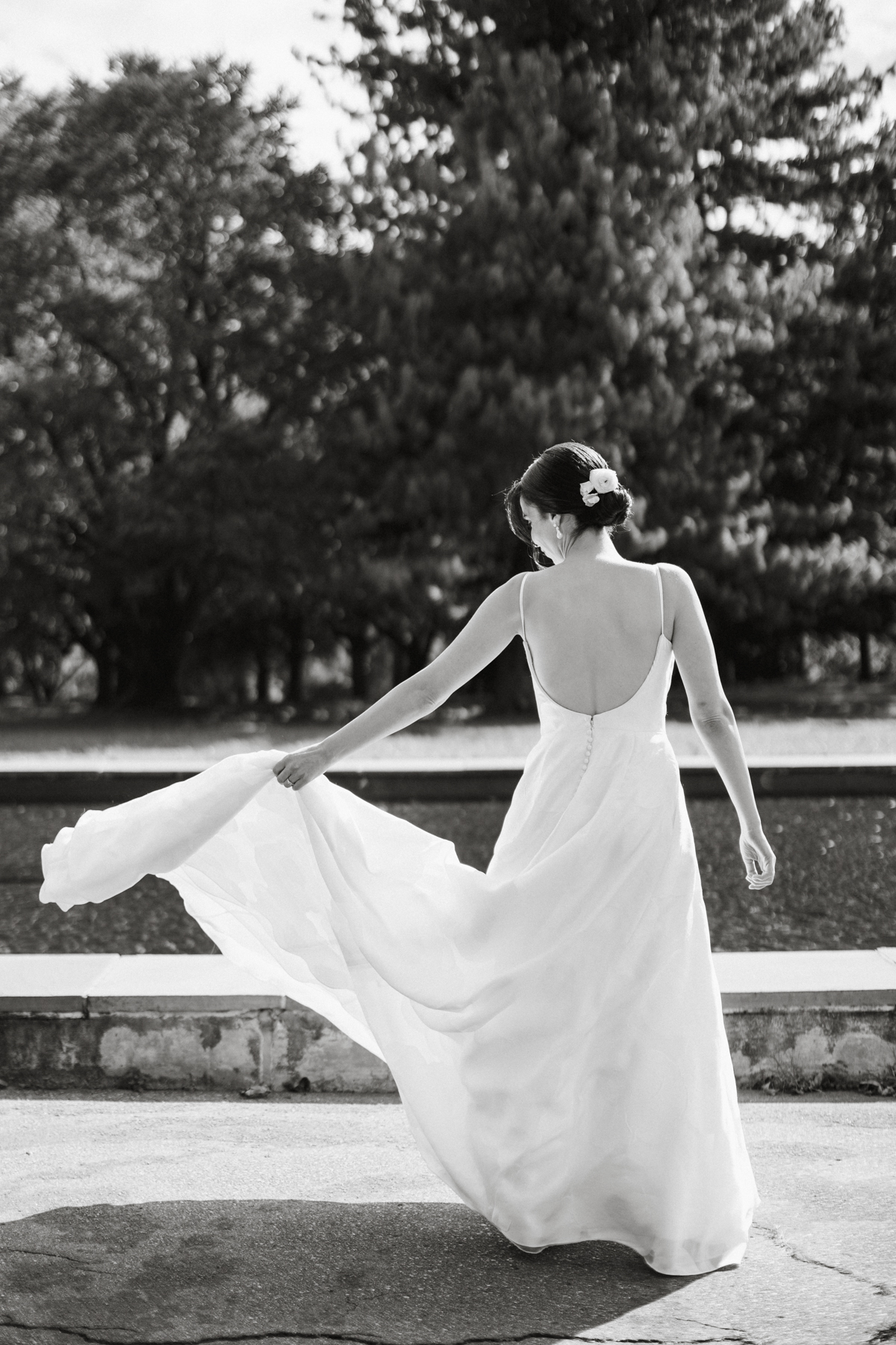 Wedding dress flowing in the breeze during bridal portraits in Fairmount Park