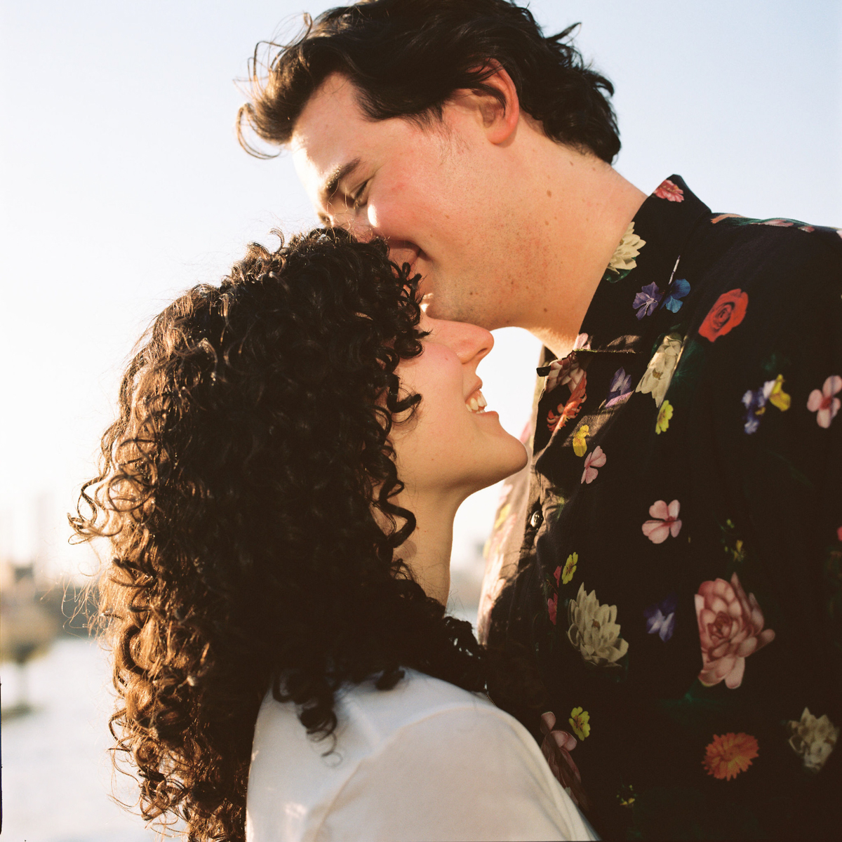 Close-up of Dylan and Olivia’s casual yet stylish outfits during their Brooklyn engagement session.
