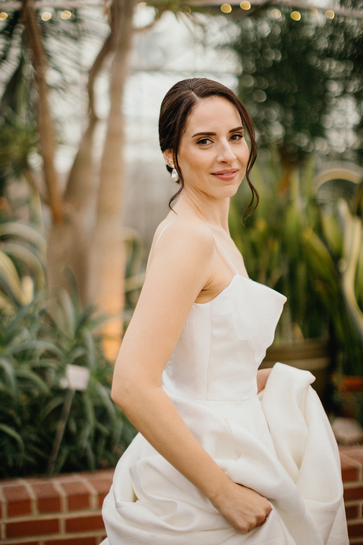 Candid of bride in Philadelphia greenhouse wedding venue