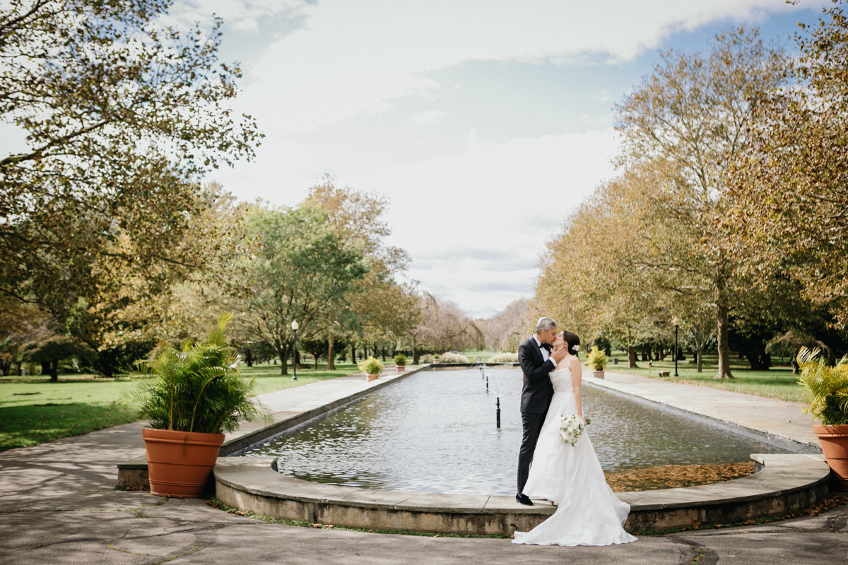 Romantic portrait of the couple surrounded by greenery in Fairmount Park