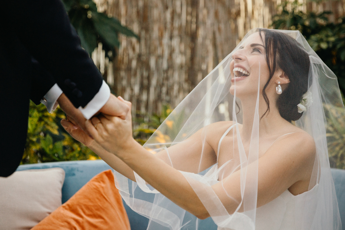 Groom veiling the bride during the badeken at the Horticulture Center