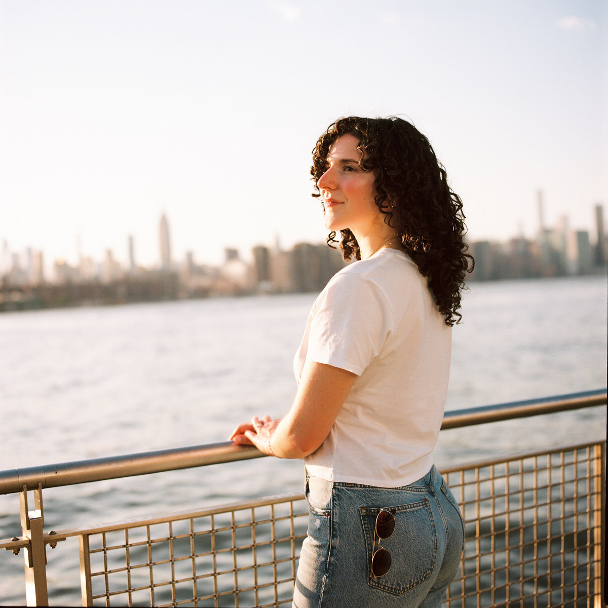 Medium format film photographer capturing intimate moments in Brooklyn engagement photos.
