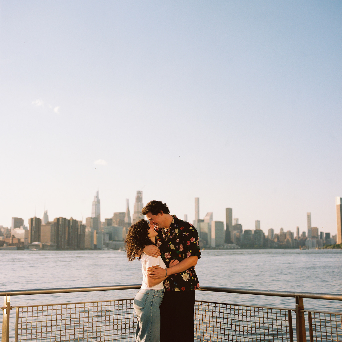 Brooklyn engagement session with a view of the NYC skyline in the background.